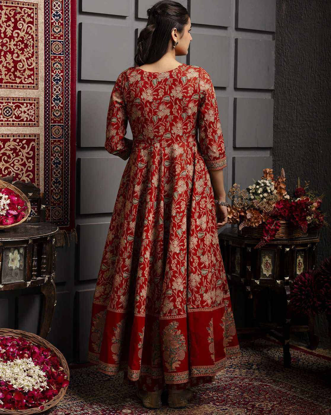 Back view of a Floral Woven Kurta Set in red with intricate gold floral patterns and three-quarter sleeves