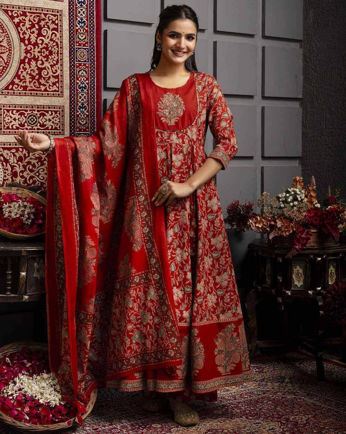 Elegant model wearing a Floral Woven Kurta Set in red, featuring intricate patterns and traditional design
