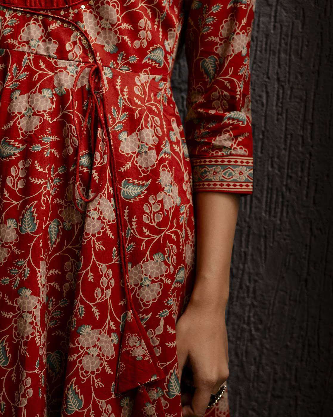 Elegant Floral Woven Kurta Set in Red Featuring Intricate Floral Patterns and Stylish Tie Detail
