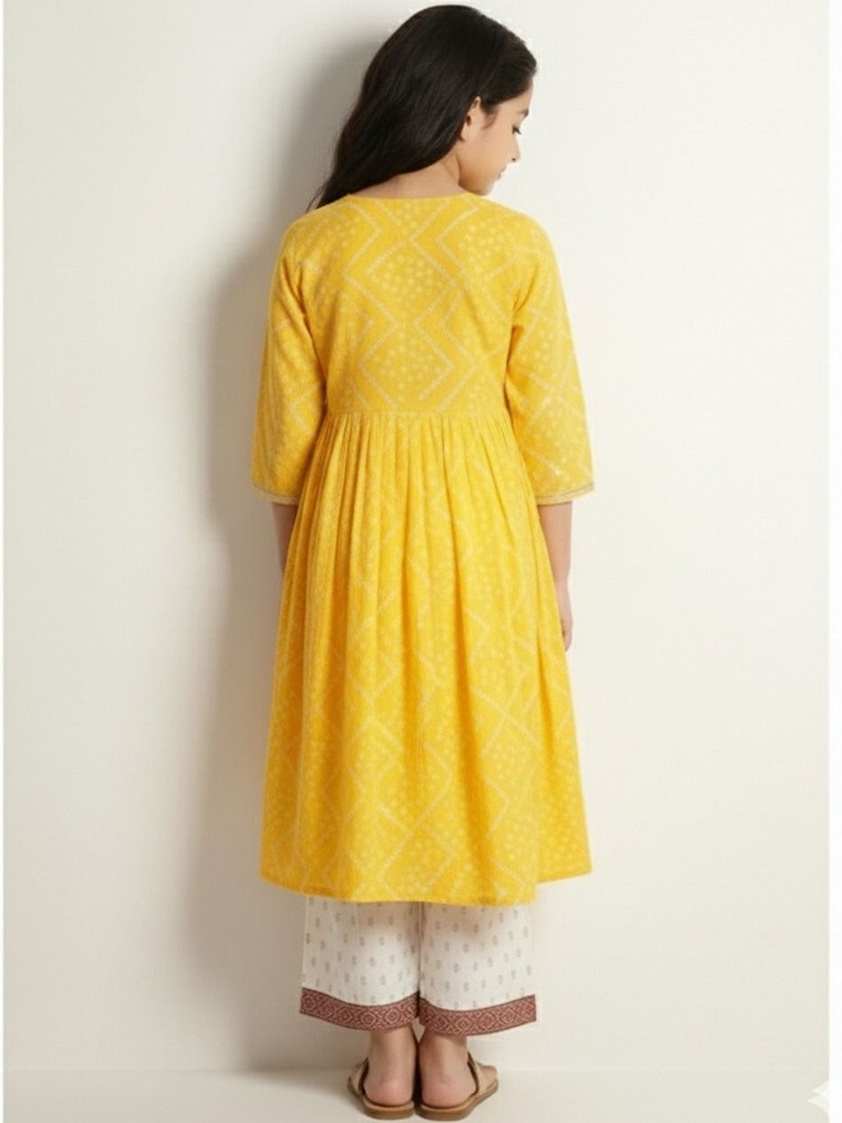 Back view of Aromie Girls Anarkali Kurta Set in yellow cotton, perfect for casual wear in Canada