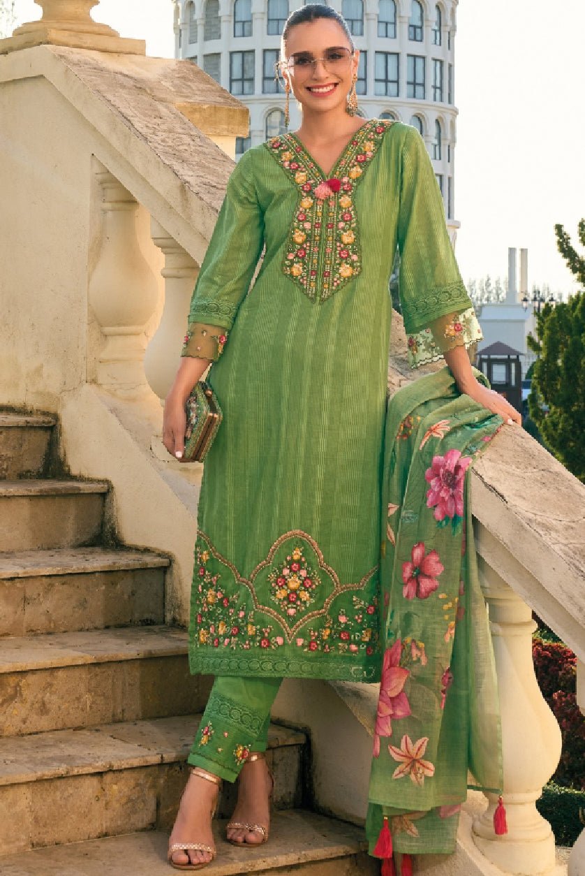 Aromie green embroidered kurta set featuring intricate floral designs, paired with matching pants and a dupatta