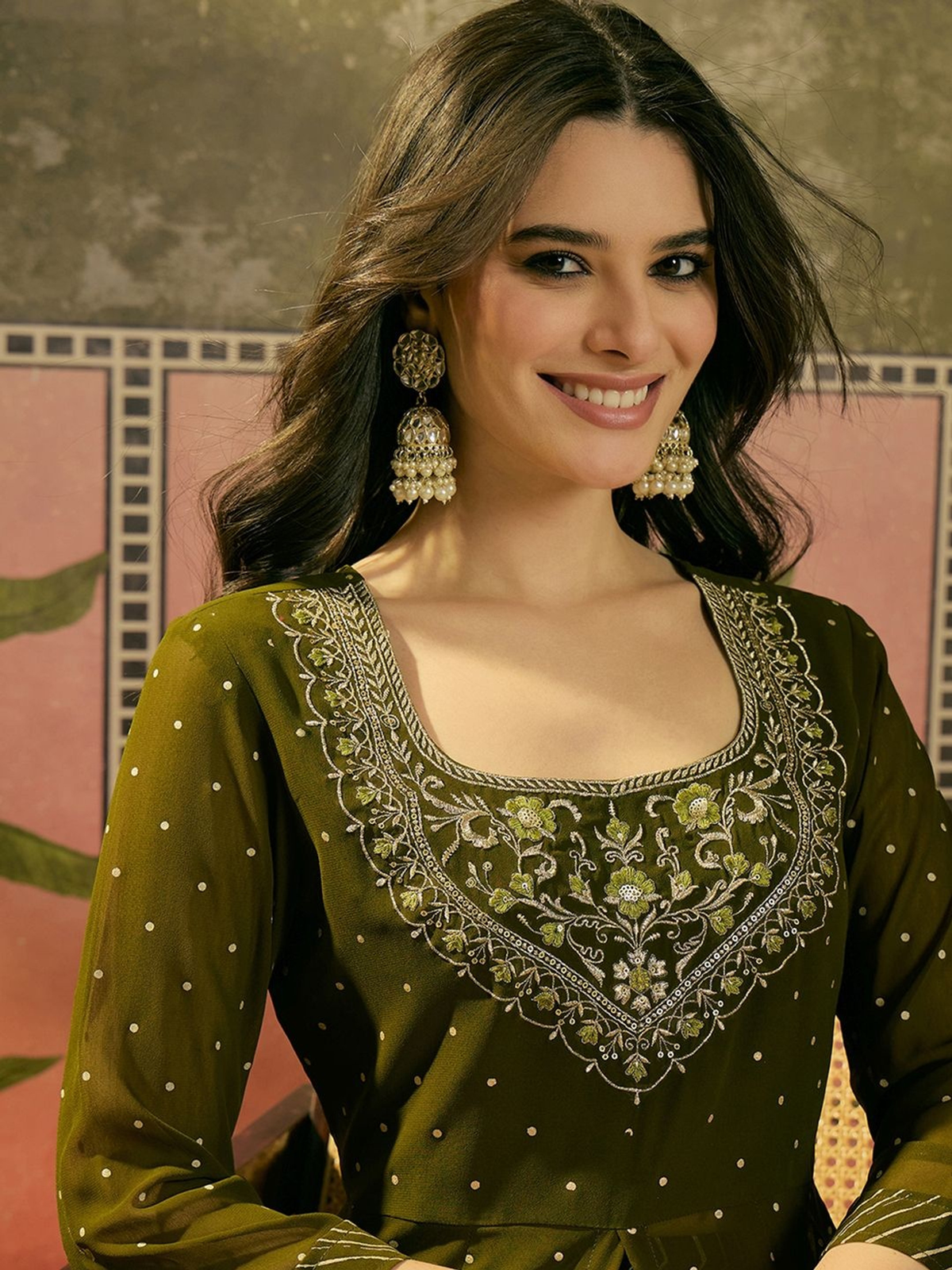 Front view of a green embroidered kurta skirt set made of soft fabric, perfect for festive occasions.