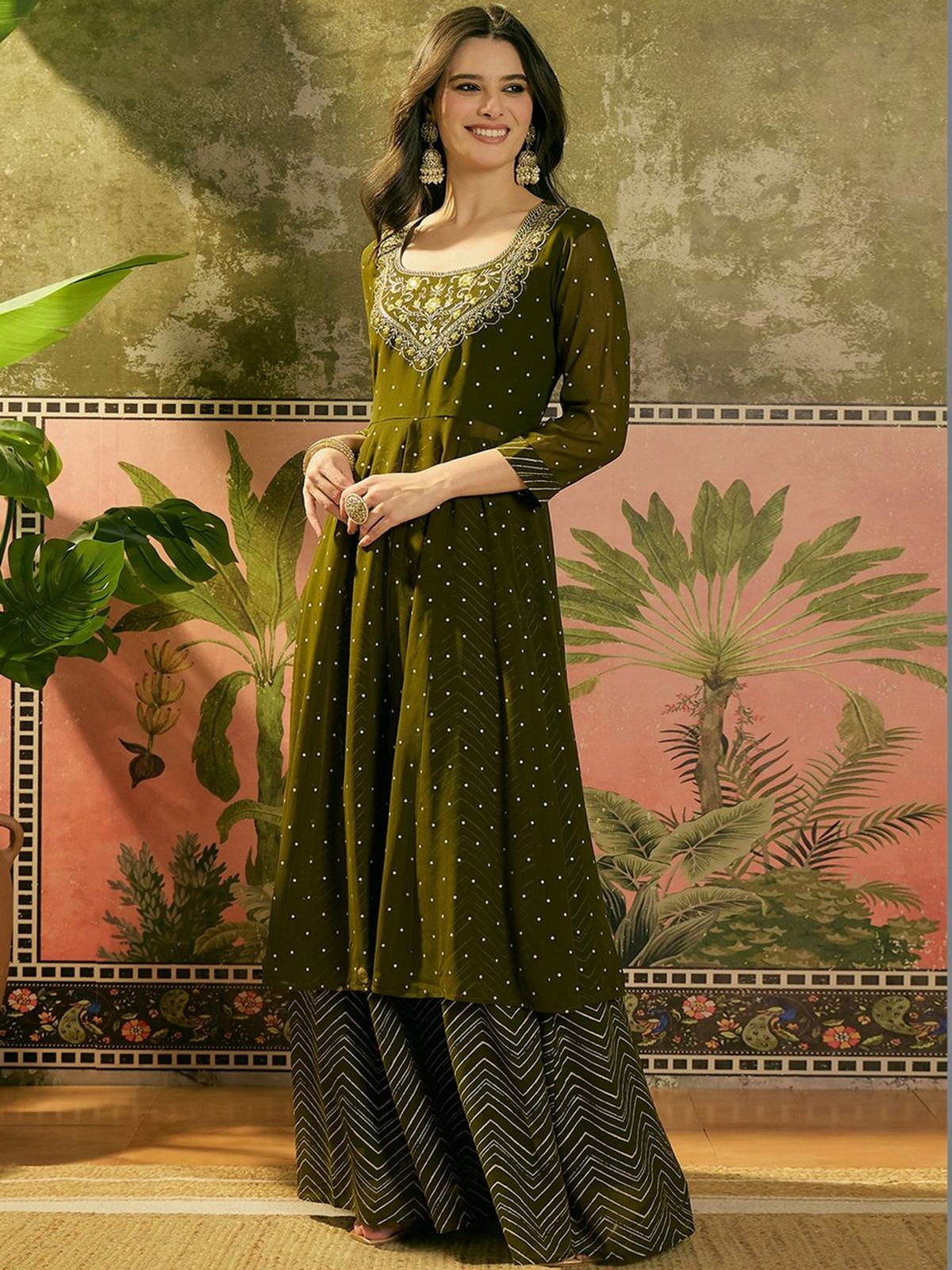 Front view of a three piece green embroidered kurta skirt set in floral fabric, ideal for festive occasions