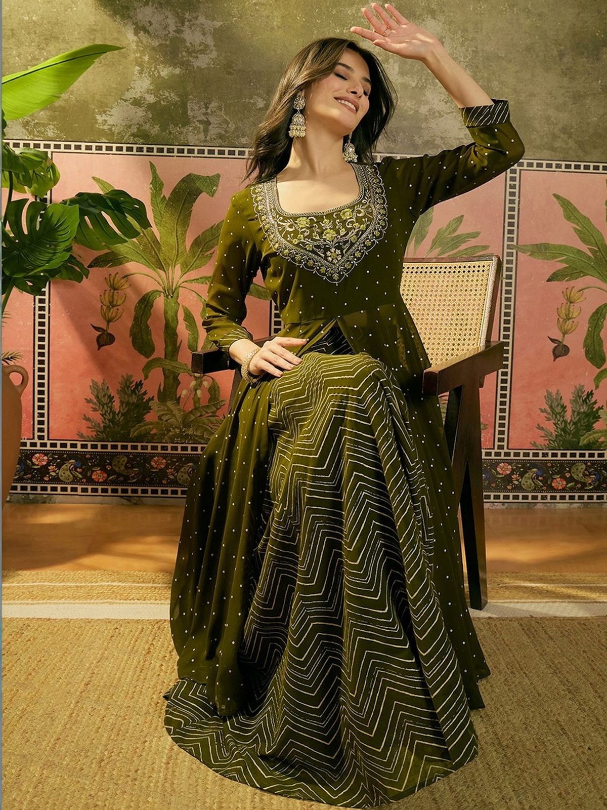 Green embroidered kurta skirt set in breathable fabric, featuring intricate designs, perfect for festive occasions