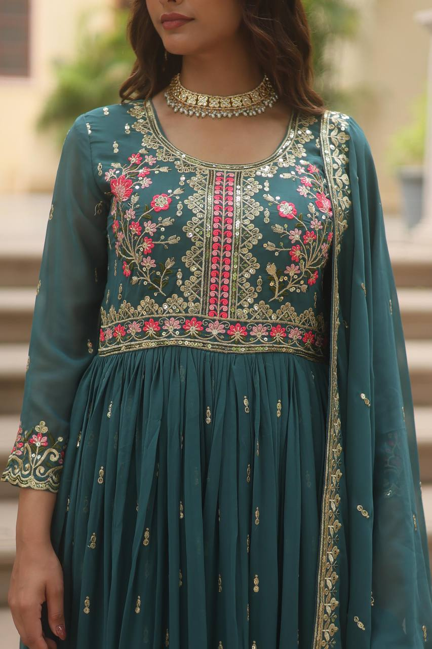 Front view of a green sharara suit set Canada featuring floral embroidery on a flowing fabric, perfect for weddings