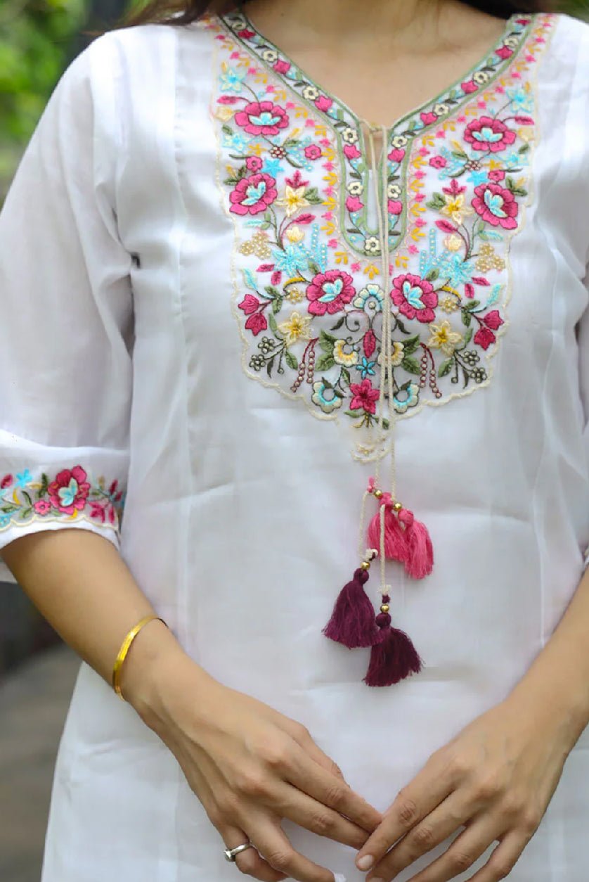 Aromie hand-embroidered Chanderi kurta set in white with colorful floral embroidery and tassels