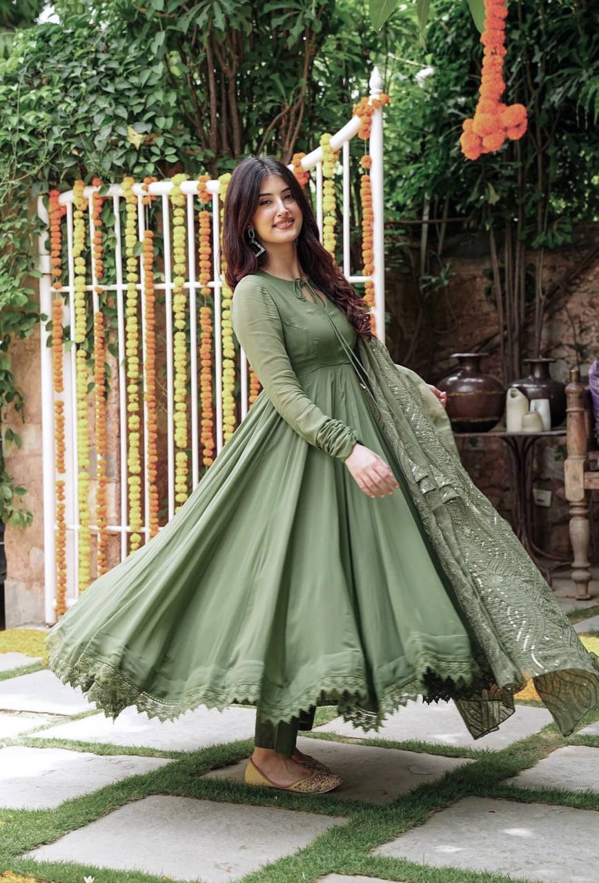 Front view of a three piece Kurtha in olive green, heavy faux georgette gown set, ideal for festive occasions.