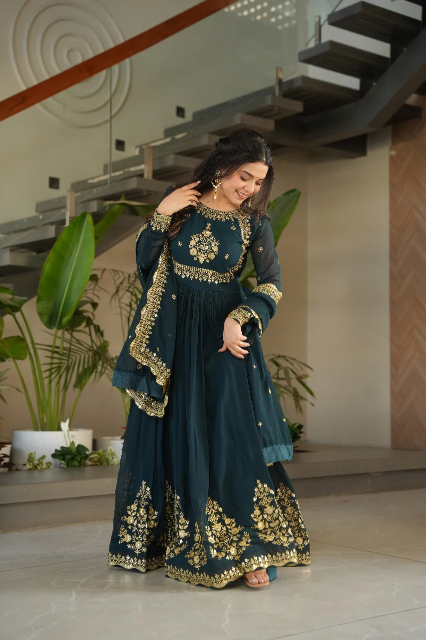 Heavy wine faux georgette gown with dupatta, featuring intricate embellishments, ideal for festive occasions.
