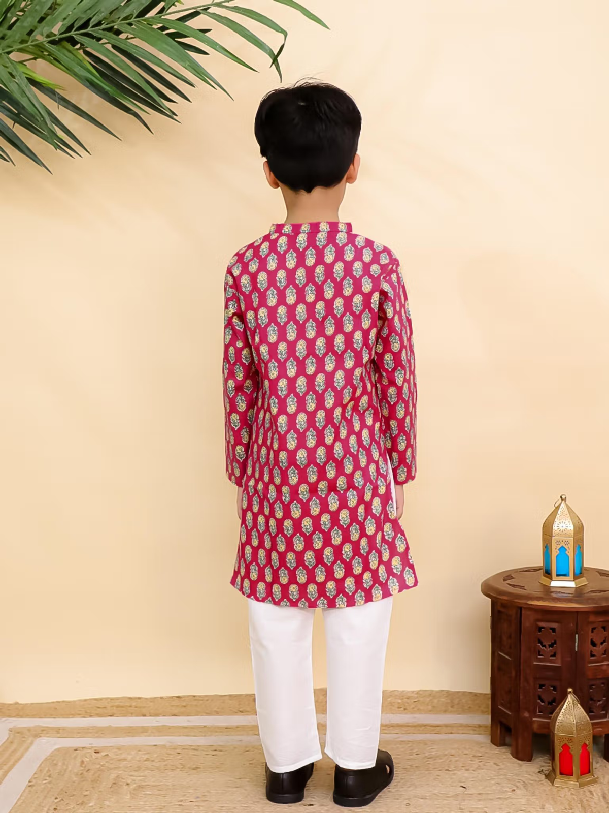 Back view of boy wearing AROMIE red printed kurta pyjama set Canada with white pyjama pants