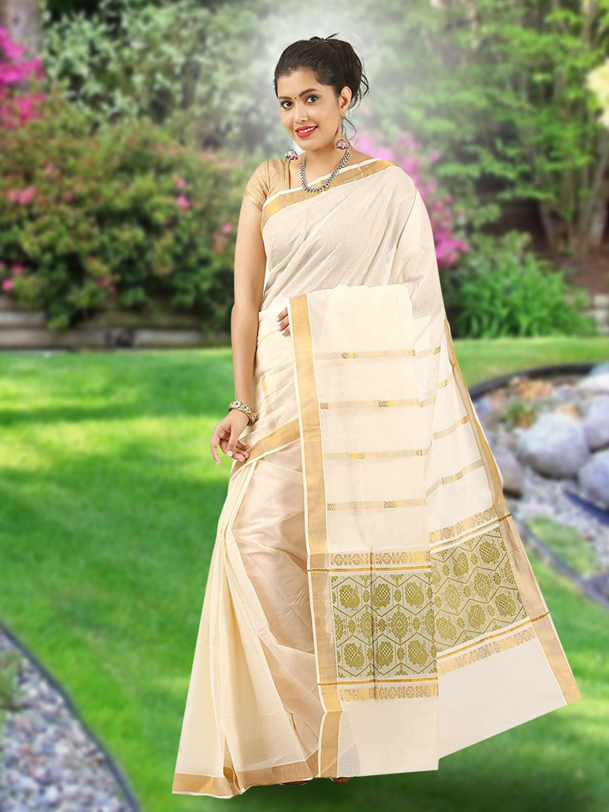 Aromie Ikat saree with zari border in cream and gold worn by a woman outdoors