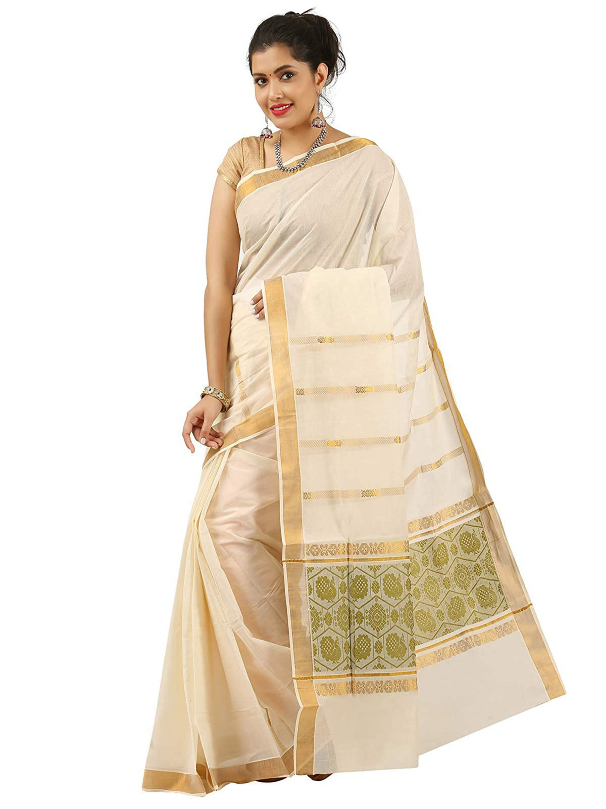 Aromie Ikat saree with zari border in cream and gold worn by a woman with matching blouse and jewelry