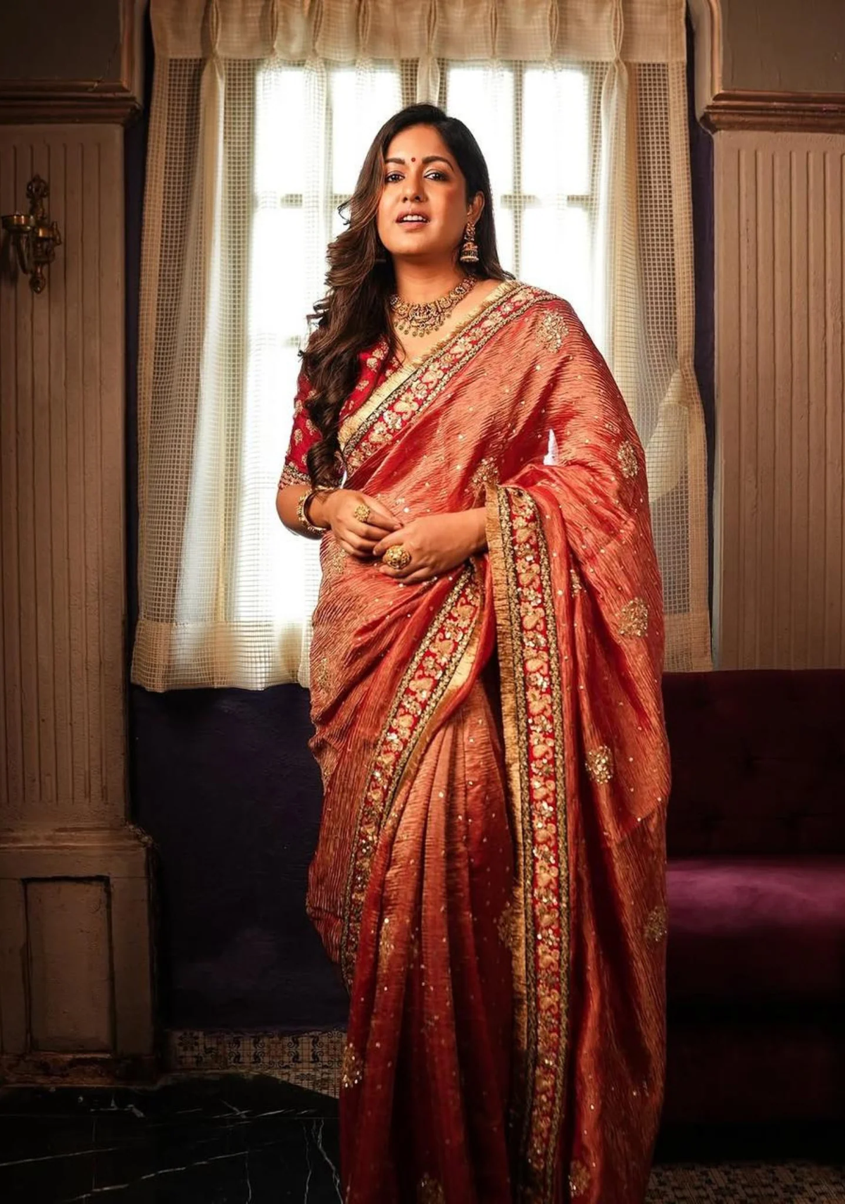 Elegant Indian chiffon saree in rust orange with intricate detailing, perfect for weddings and special occasions, from aromie.