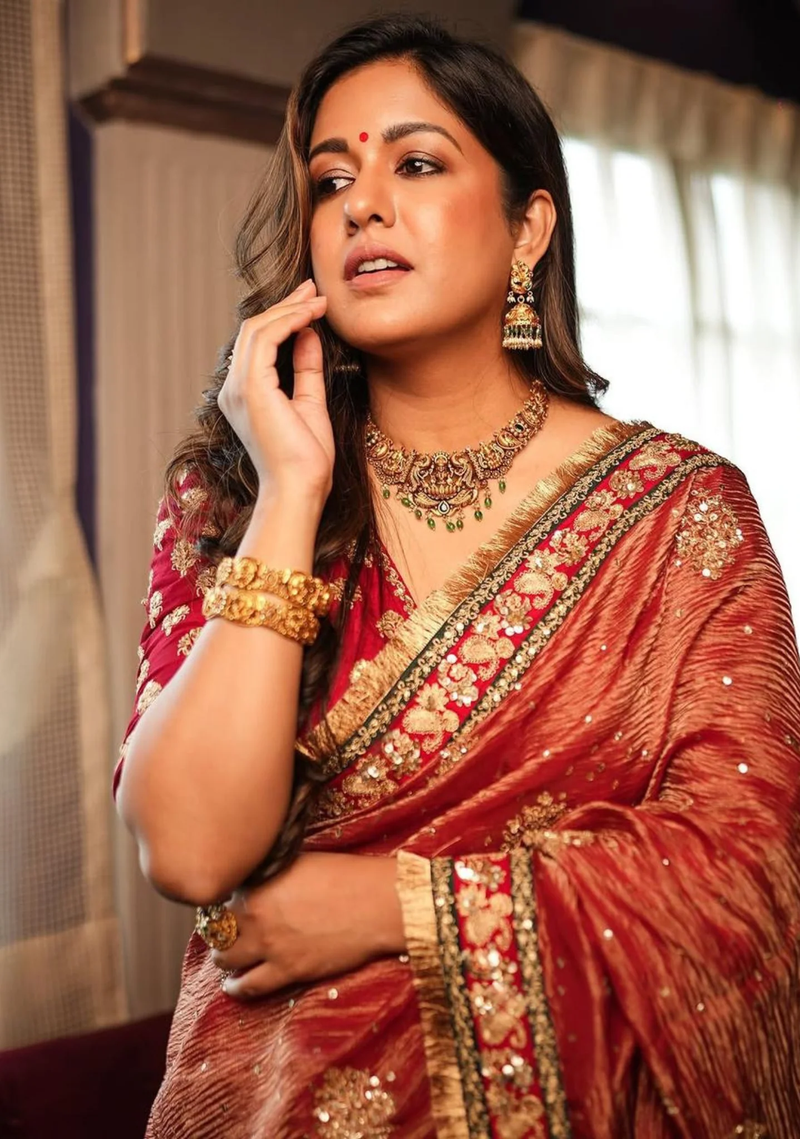 Front view of a red Indian chiffon saree from Aromie, detailed with gold embroidery, perfect for weddings.