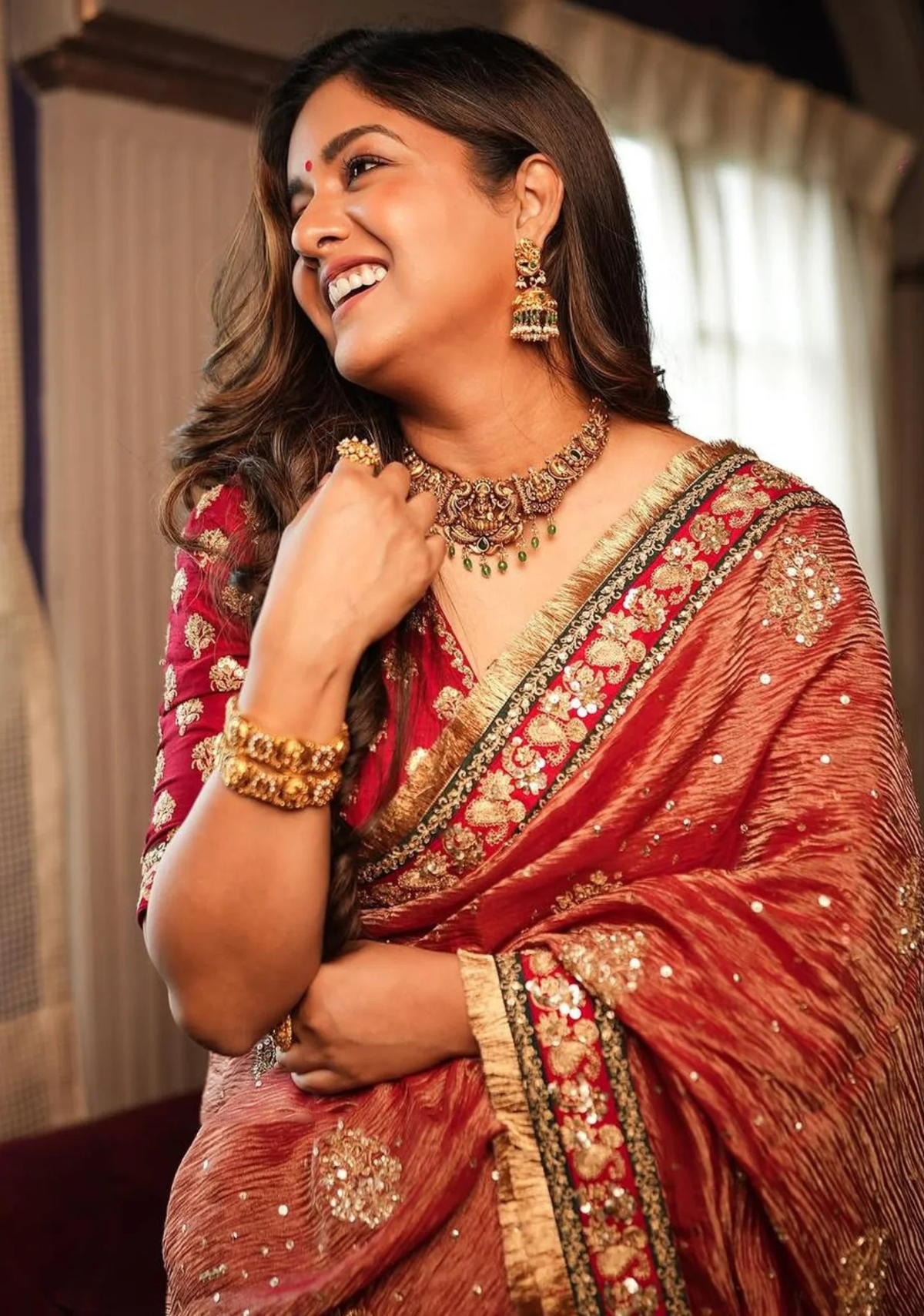 Front view of a beautiful red Indian chiffon saree by aromie, perfect for weddings with intricate embroidery details