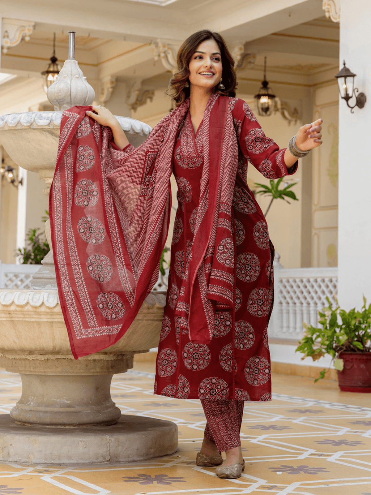 Three piece Kurtha set in maroon with intricate prints, perfect for festive occasions, available in Indian Clothing Online Canada