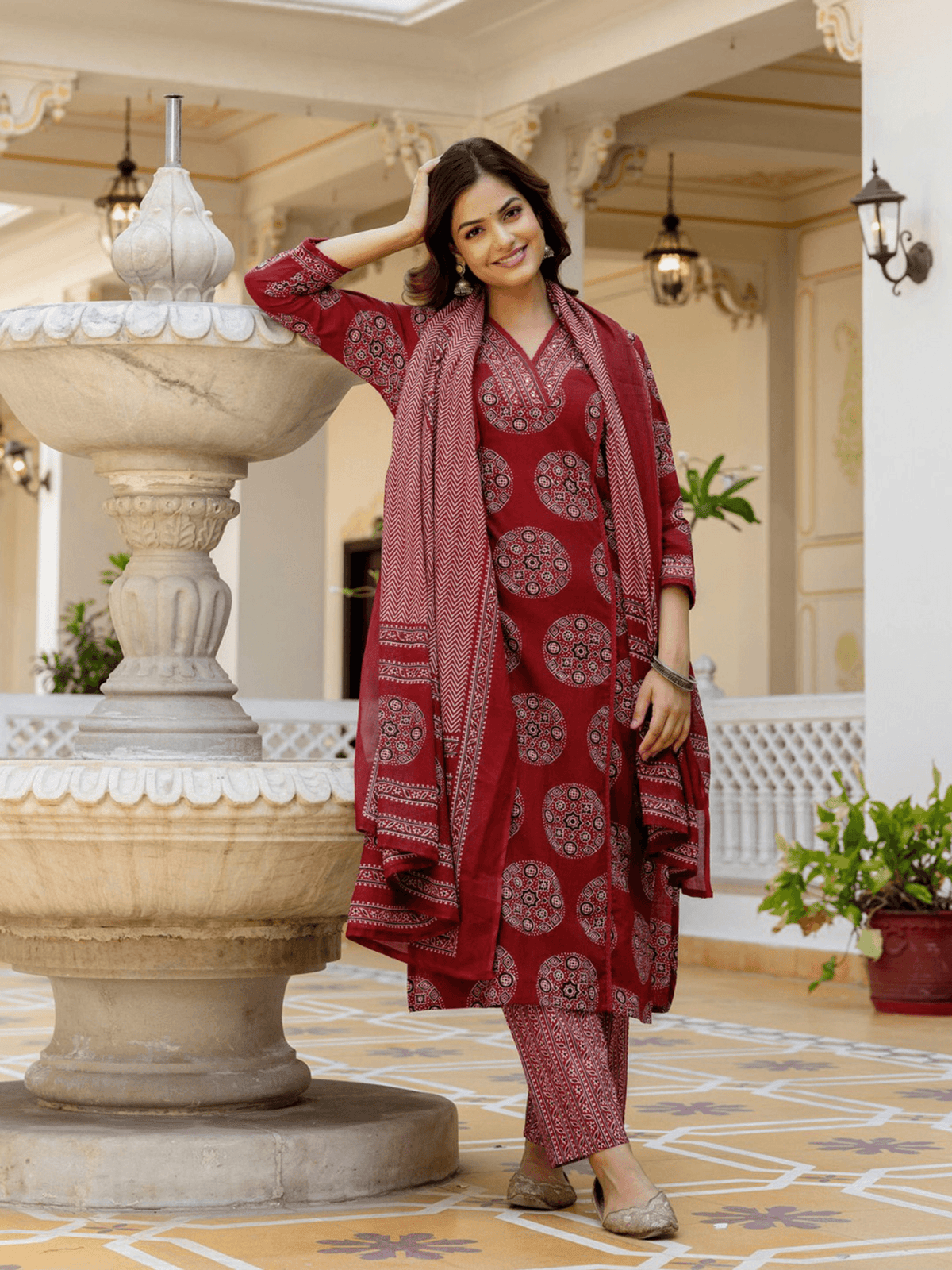 Three piece maroon Kurtha set in cotton with detailed patterns, perfect for festive occasions from aromie