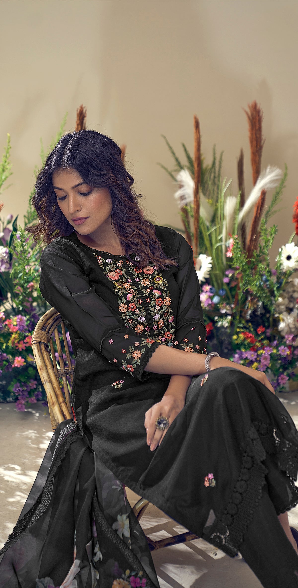 Three piece black Kurtha with floral embroidery, perfect for festive occasions in Canada, featuring a detail view