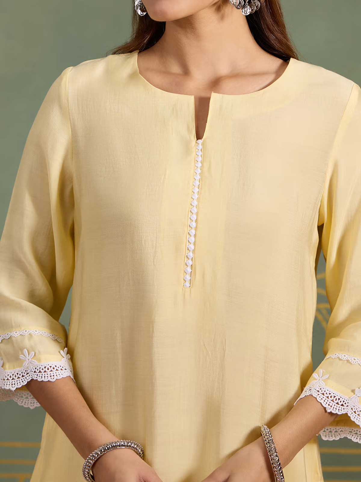 Aromie single piece kurta in light yellow with white lace detailing on sleeve cuffs Indian fusion jumpsuit