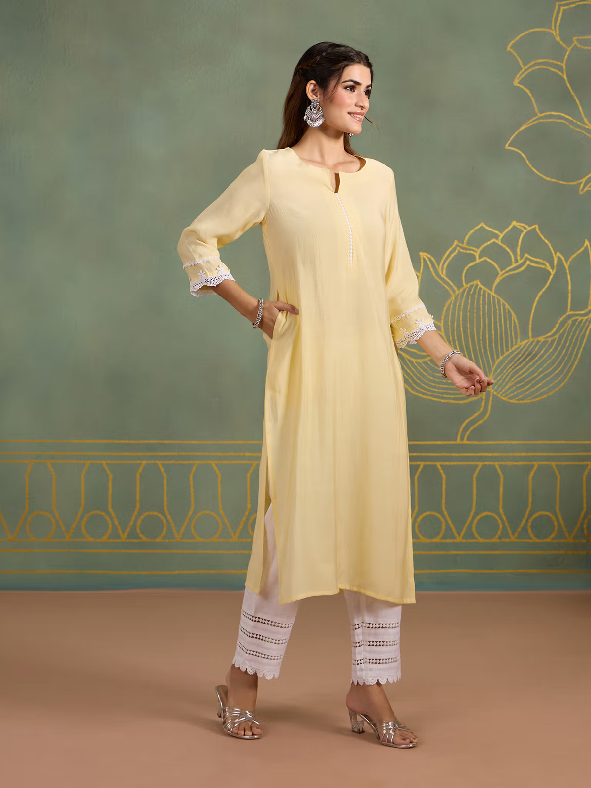 Aromie single piece kurta styled as Indian fusion jumpsuit in pastel yellow with white lace pants