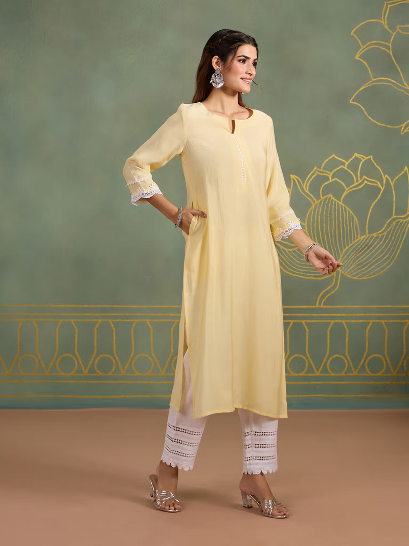 Aromie single piece kurta styled as Indian fusion jumpsuit in pastel yellow with white lace pants