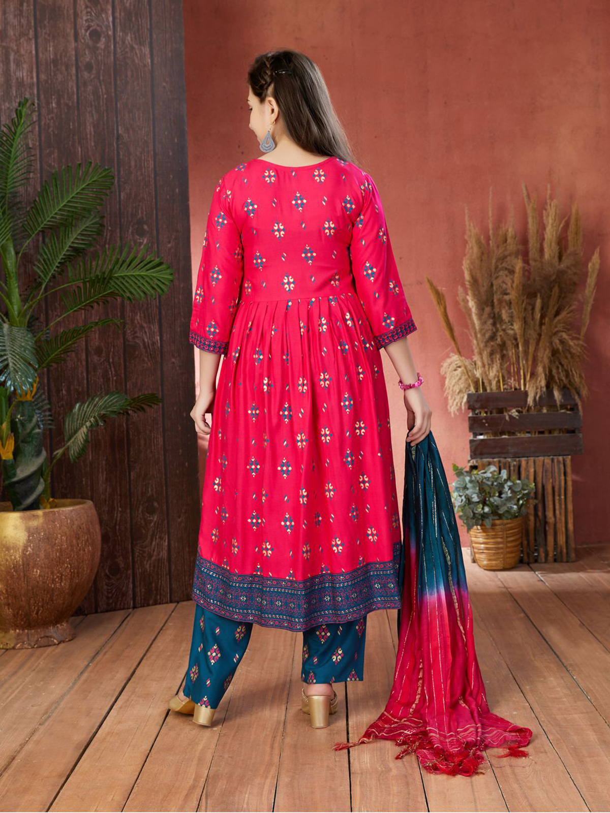 Aromie Indian Girls Dress USA in vibrant pink with intricate patterns, shown from the back, perfect for festive occasions.