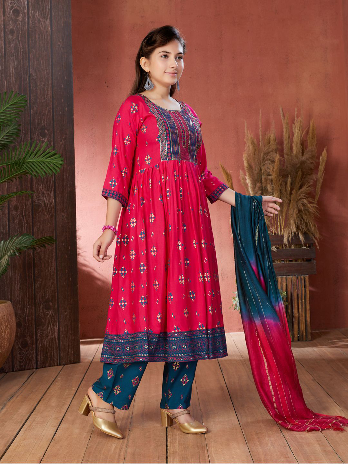 Aromie Indian Girls Dress USA in vibrant pink with intricate detailing, perfect for festive occasions.
