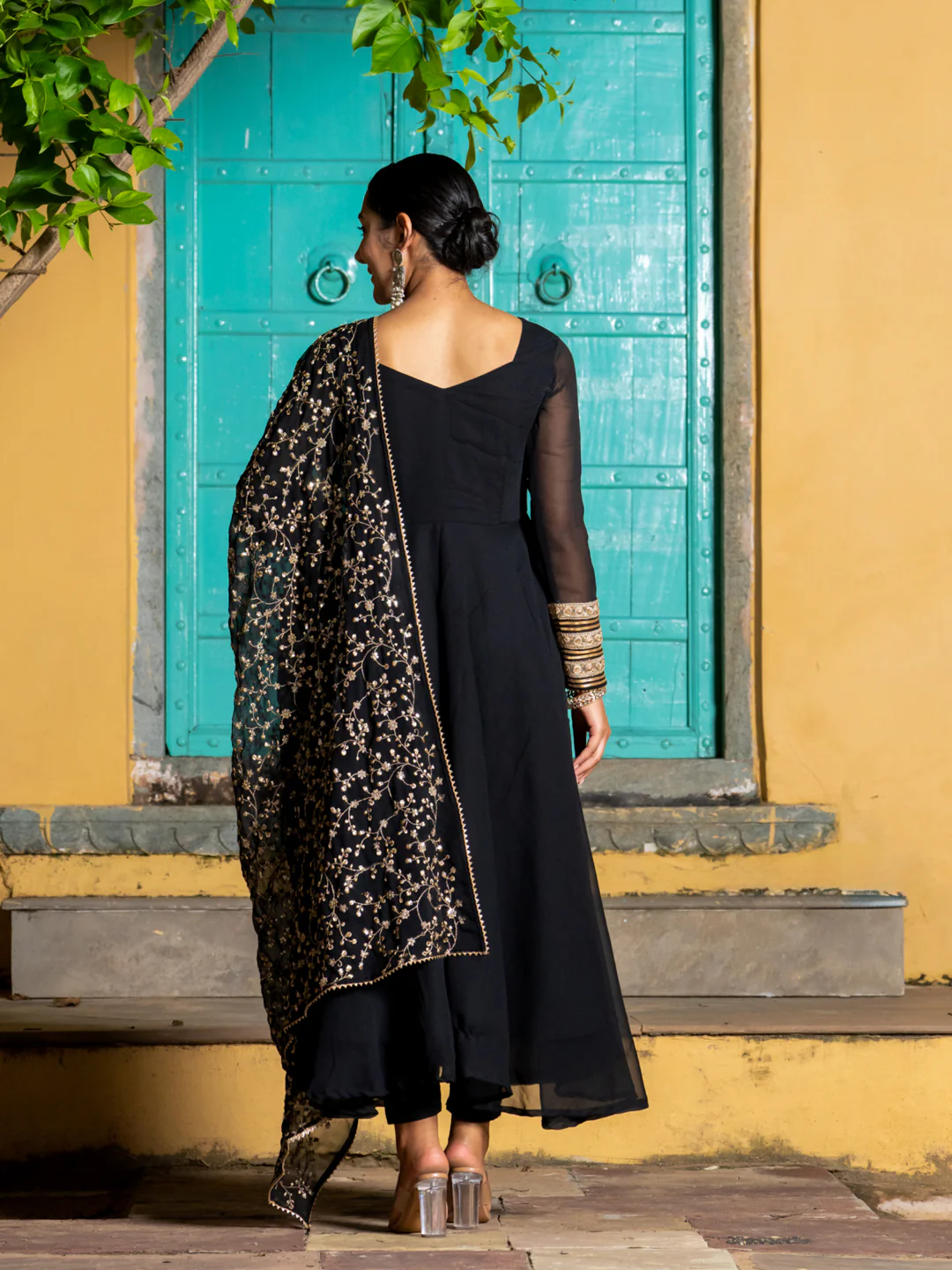 Black three piece kurta set for women made of lightweight fabric, perfect for festive occasions
