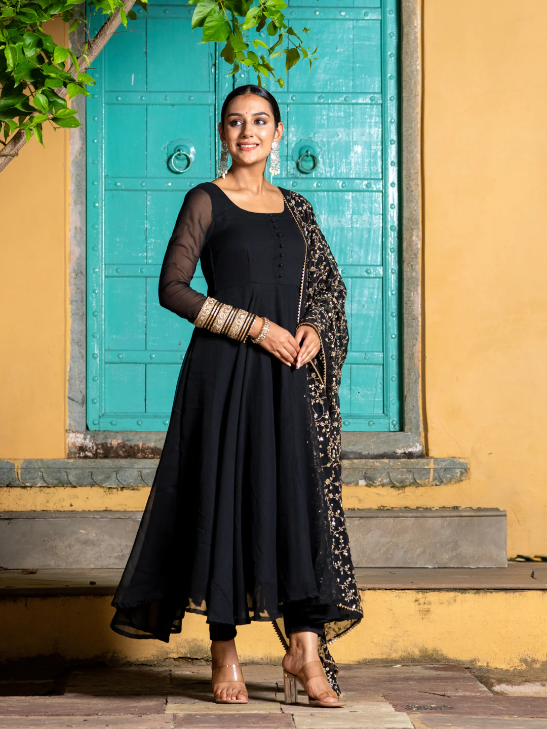 Elegant black three piece kurta set for women in soft fabric, perfect for festive occasions and weddings.