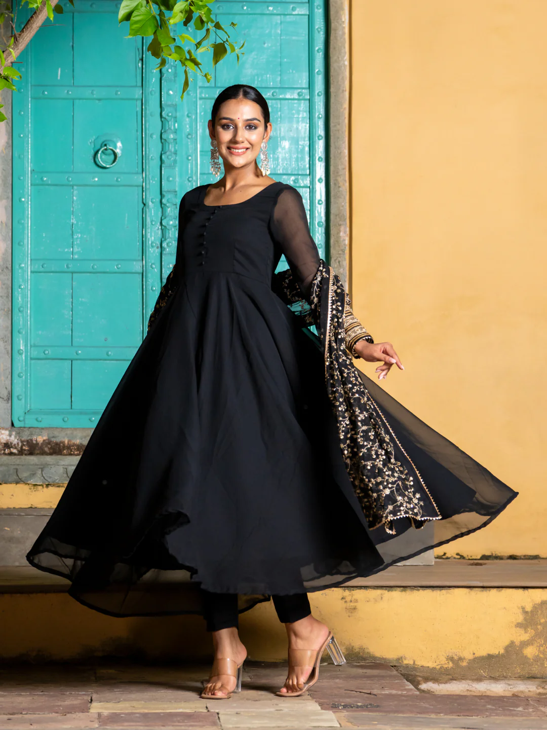 Black three piece kurta set for women in lightweight fabric, perfect for festive occasions and weddings.