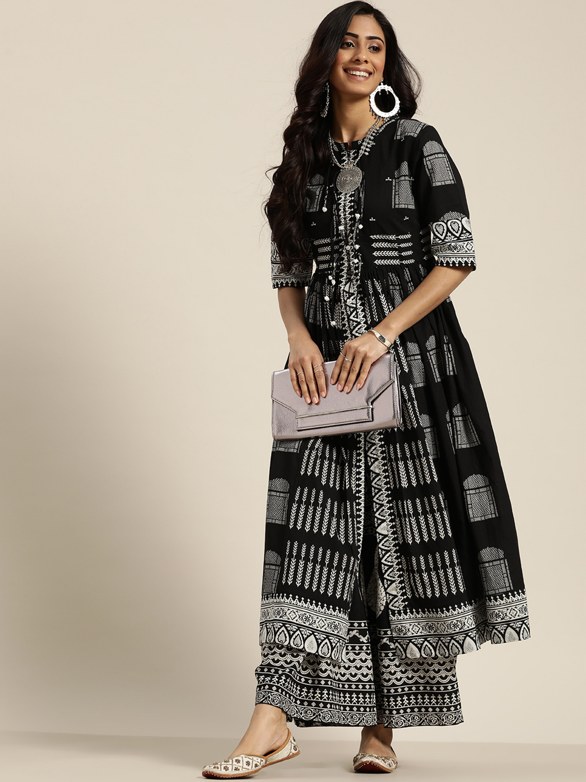 Black three piece Kurtha set by Aromie with intricate patterns, perfect for festive occasions in the USA.
