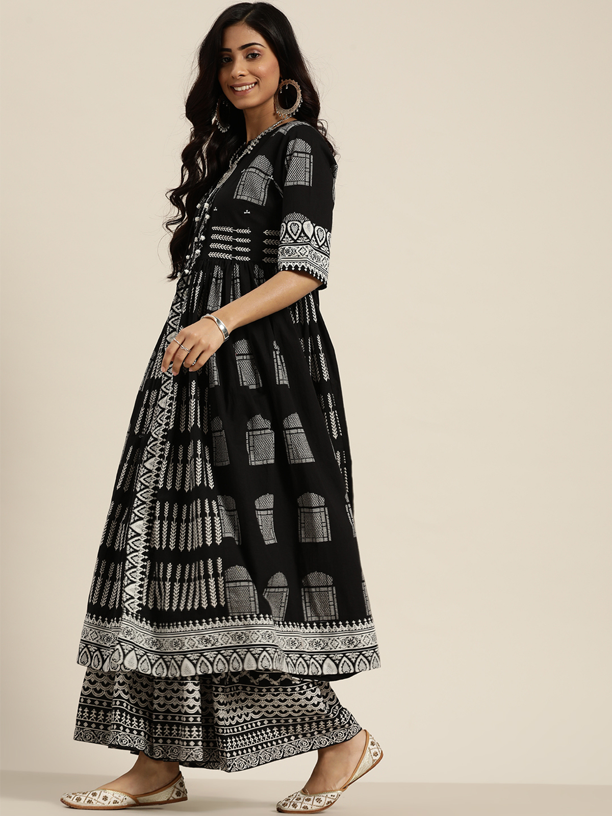 Black three piece kurta set with traditional patterns, ideal for festive occasions in the USA