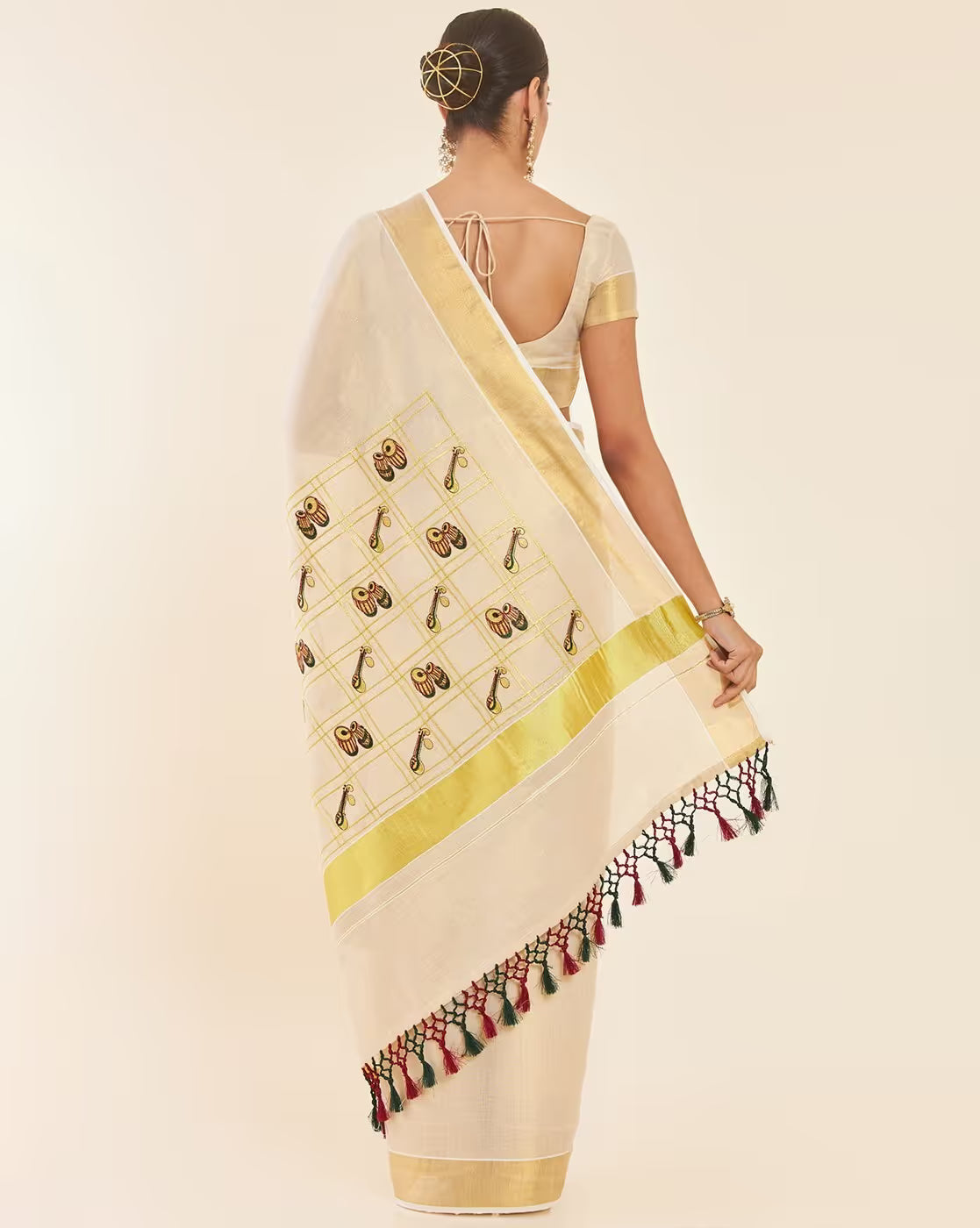 Elegant Kasavu Saree Canada in cream with intricate embroidery, ideal for festive occasions and weddings