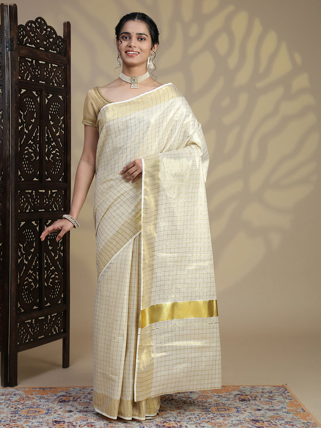 Elegant ivory Kerala Saree in silk blend for celebrations in Canada with detailed border and soft drape