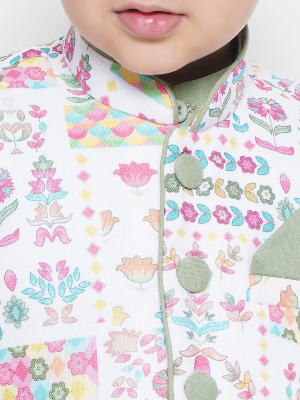 Close up of child wearing boys peach kurta dhoti set Canada pastel floral mandarin collar with fabric buttons and pocket