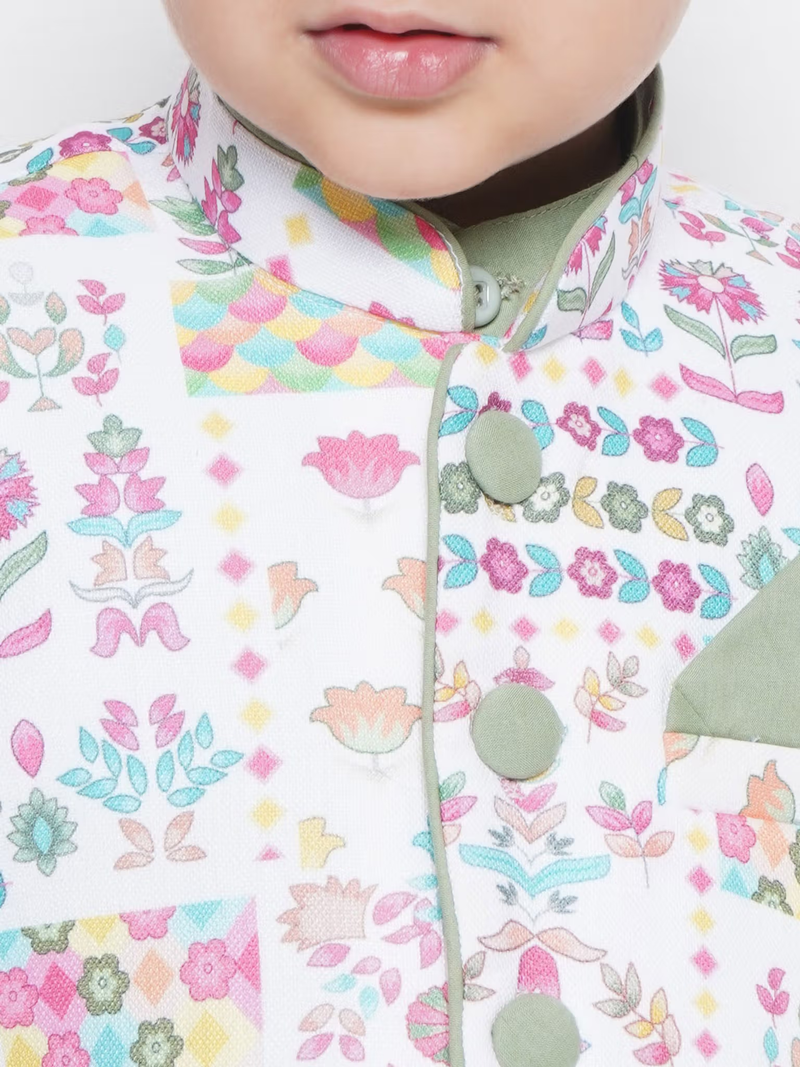 Close up of child wearing boys peach kurta dhoti set Canada pastel floral mandarin collar with fabric buttons and pocket