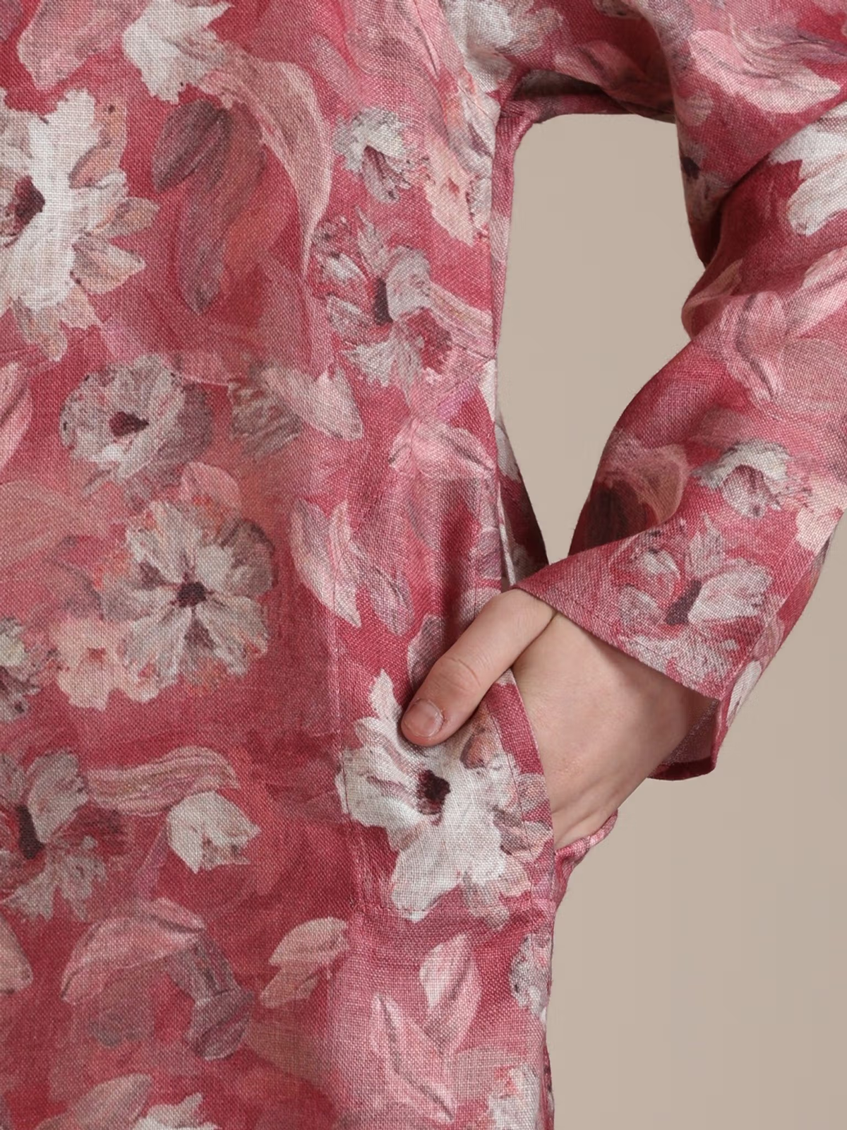 boys pink kurta pyjama set Canada AROMIE floral printed kurta close up showing sleeve and hand in pocket