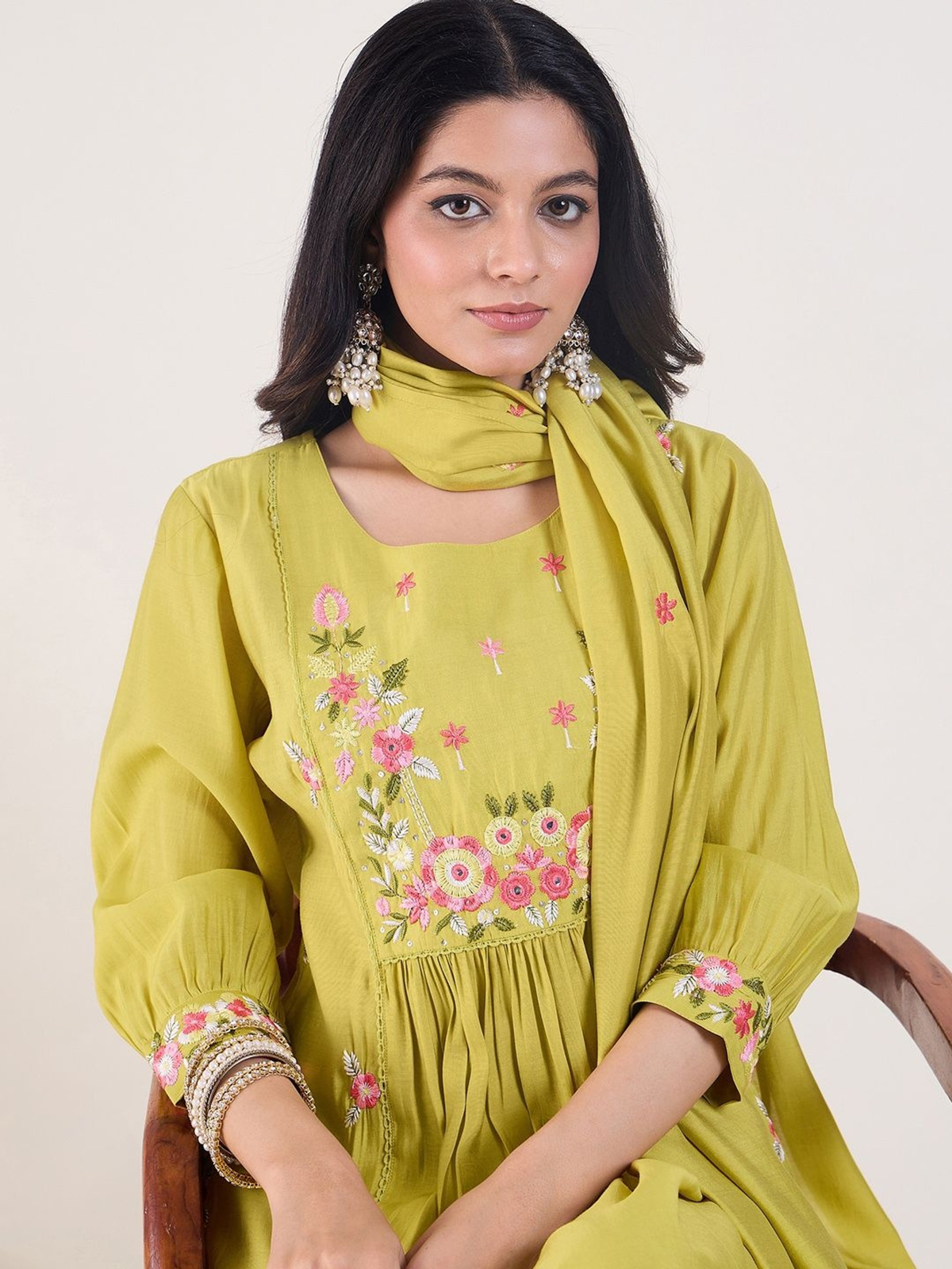 Front view of a yellow kurta set for women with floral embroidery and matching scarf, perfect for festive occasions