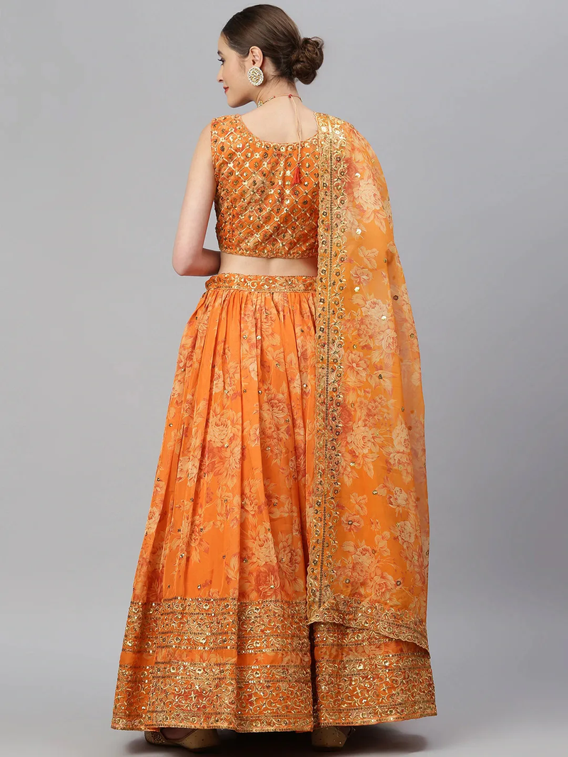 Orange lehenga choli set Canada with intricate floral design, perfect for weddings and festive occasions