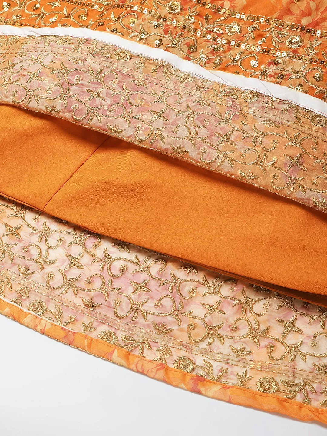 Detailed view of an orange lehenga choli set Canada with intricate embroidery, ideal for weddings and festive occasions