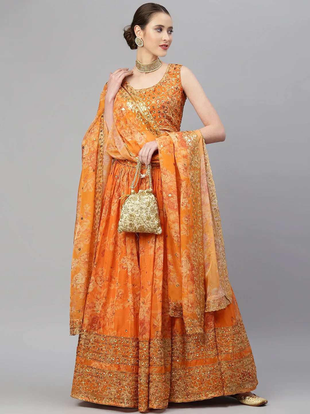 Elegant orange lehenga choli set Canada in floral pattern, perfect for weddings and festive occasions