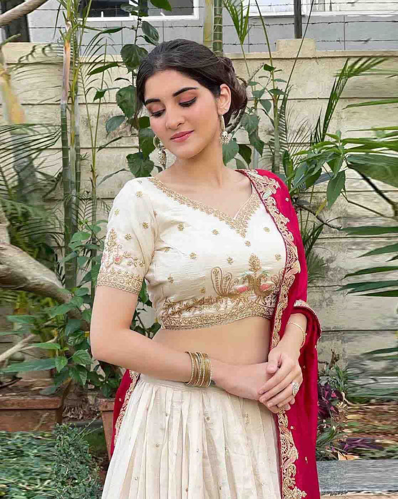 Beautiful lehenga choli set Canada featuring intricate embroidery and a stylish red dupatta