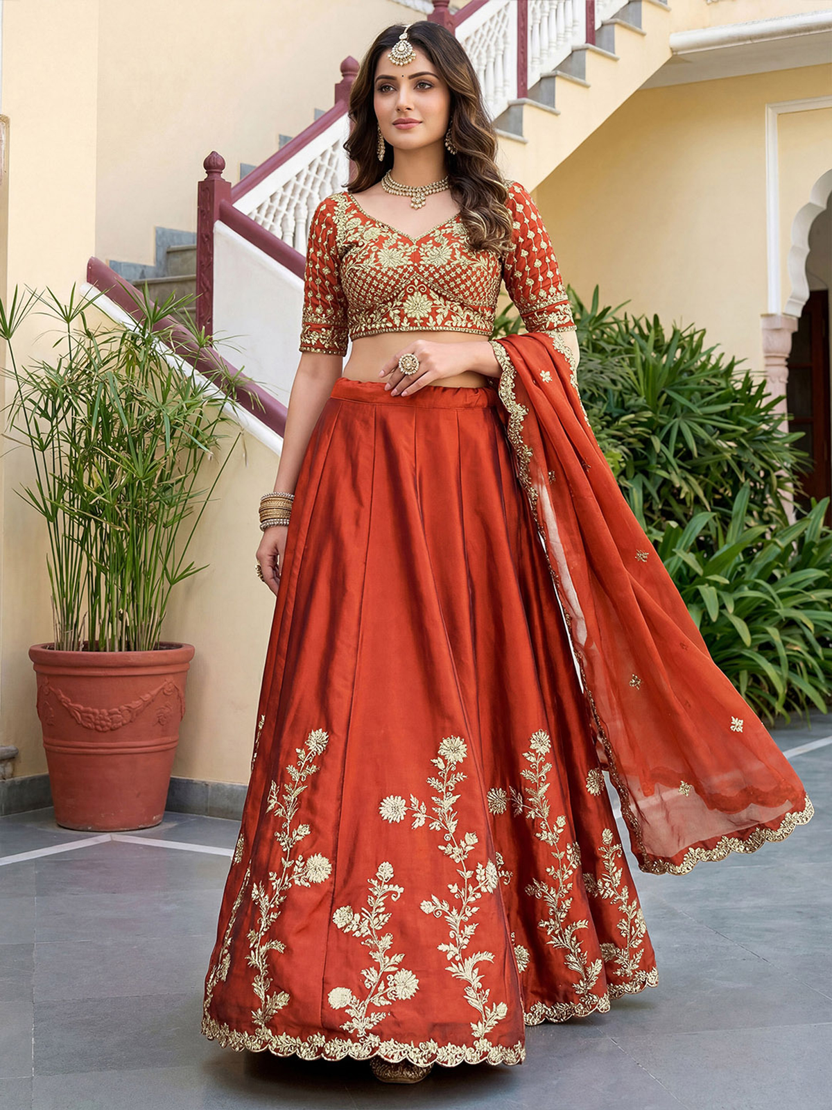 Elegant rust lehenga choli set USA with intricate golden embroidery, perfect for weddings and festive occasions