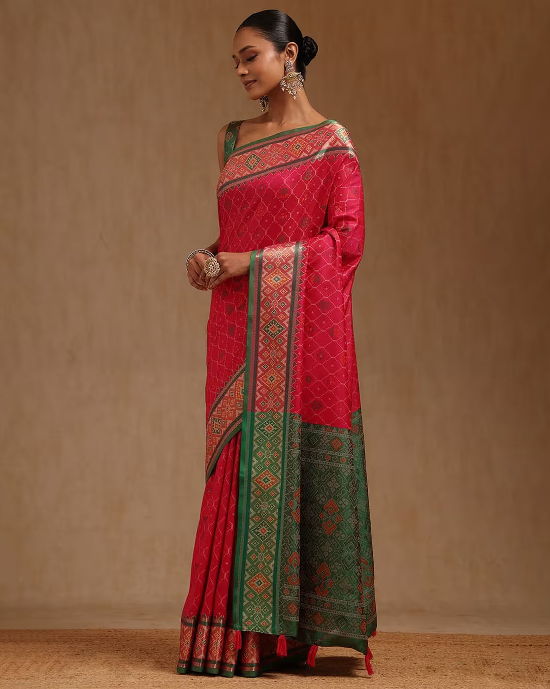 Aromie red linen saree with green border details, ideal for festive occasions and special events in Canada