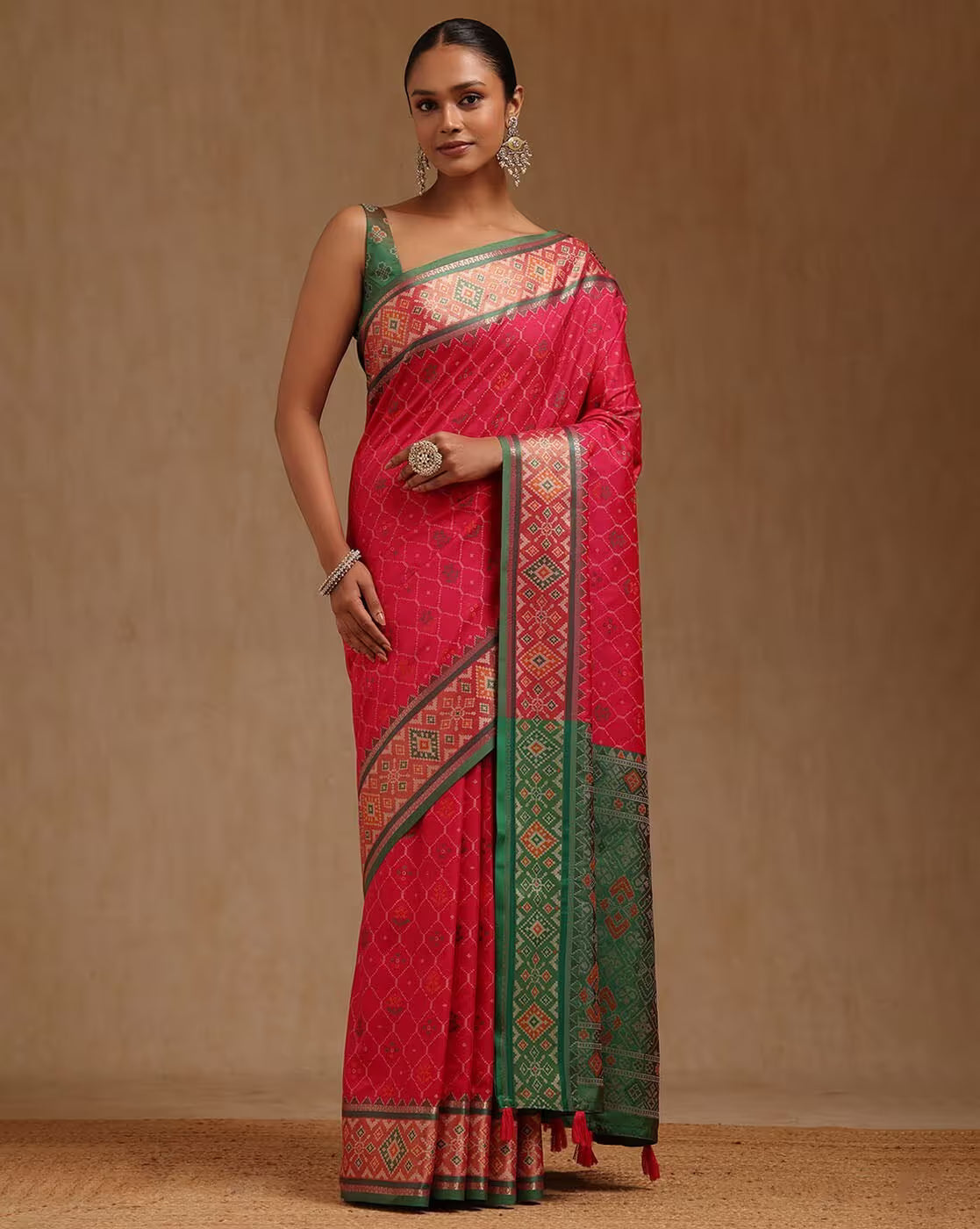 Pink and green linen saree Canada displayed on a model, perfect for festive occasions or weddings