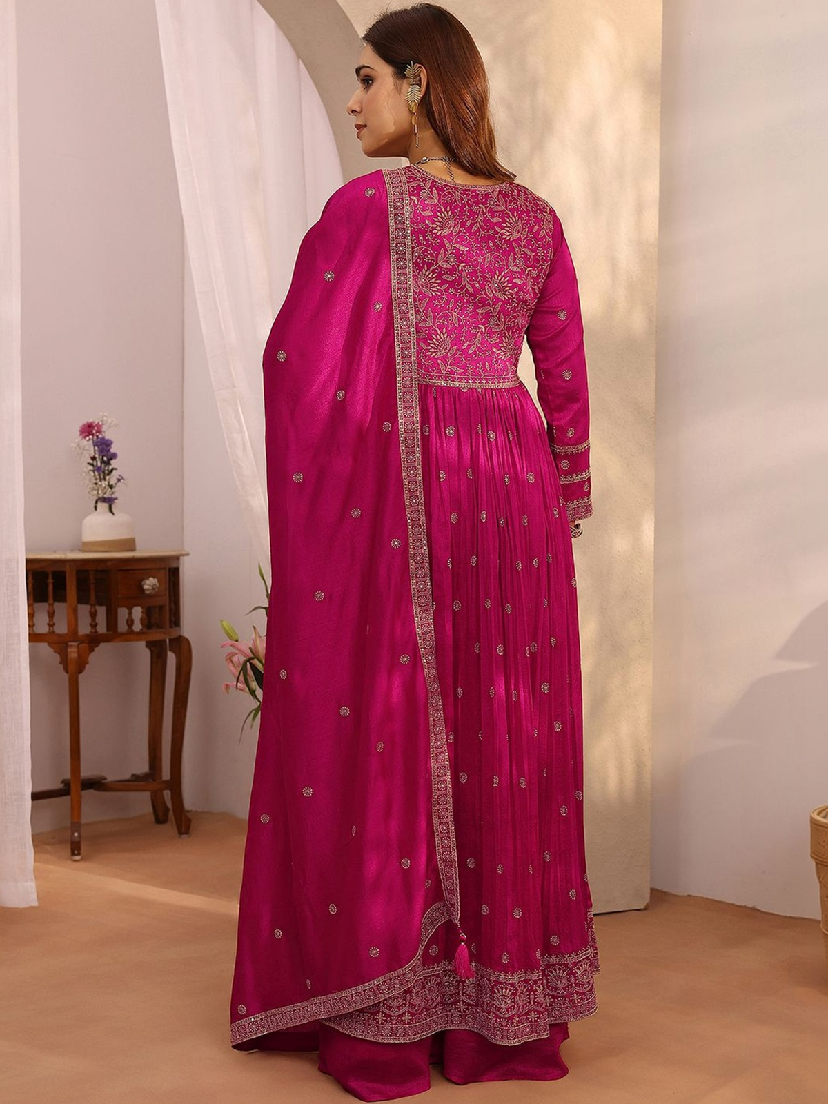 Elegant magenta Anarkali kurta palazzo set with intricate embroidery and flowing design for stylish occasions