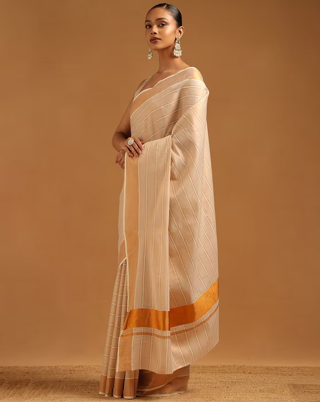 Elegant beige and gold striped Georgette saree for women, perfect for special occasions in Canada.