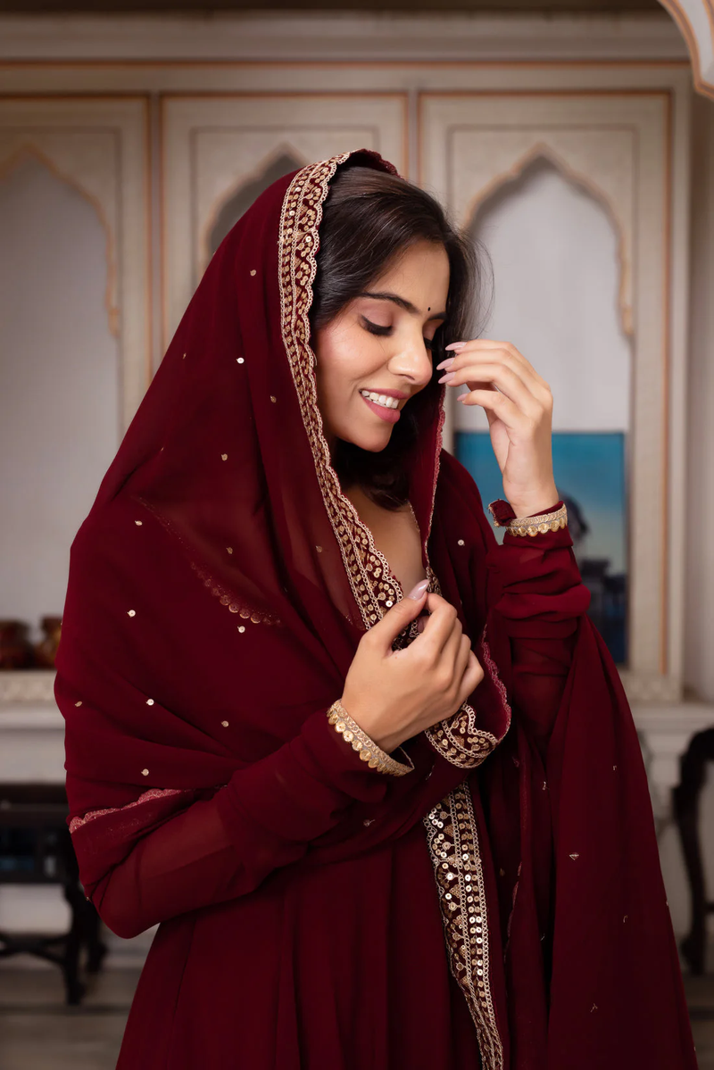 Front view of a maroon Anarkali suit set Canada with intricate embroidery, perfect for festive occasions.