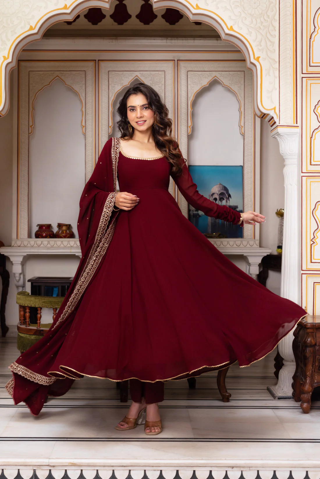 Front view of a maroon Anarkali suit set from Aromie, featuring elegant detailing, suitable for weddings in Canada.
