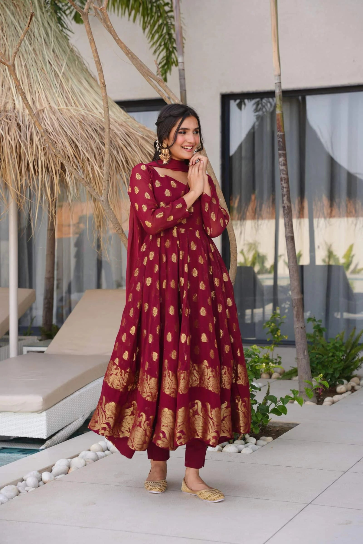 Maroon anarkali suit set with gold floral patterns, ideal for weddings and festive occasions, featuring a detailed front view.