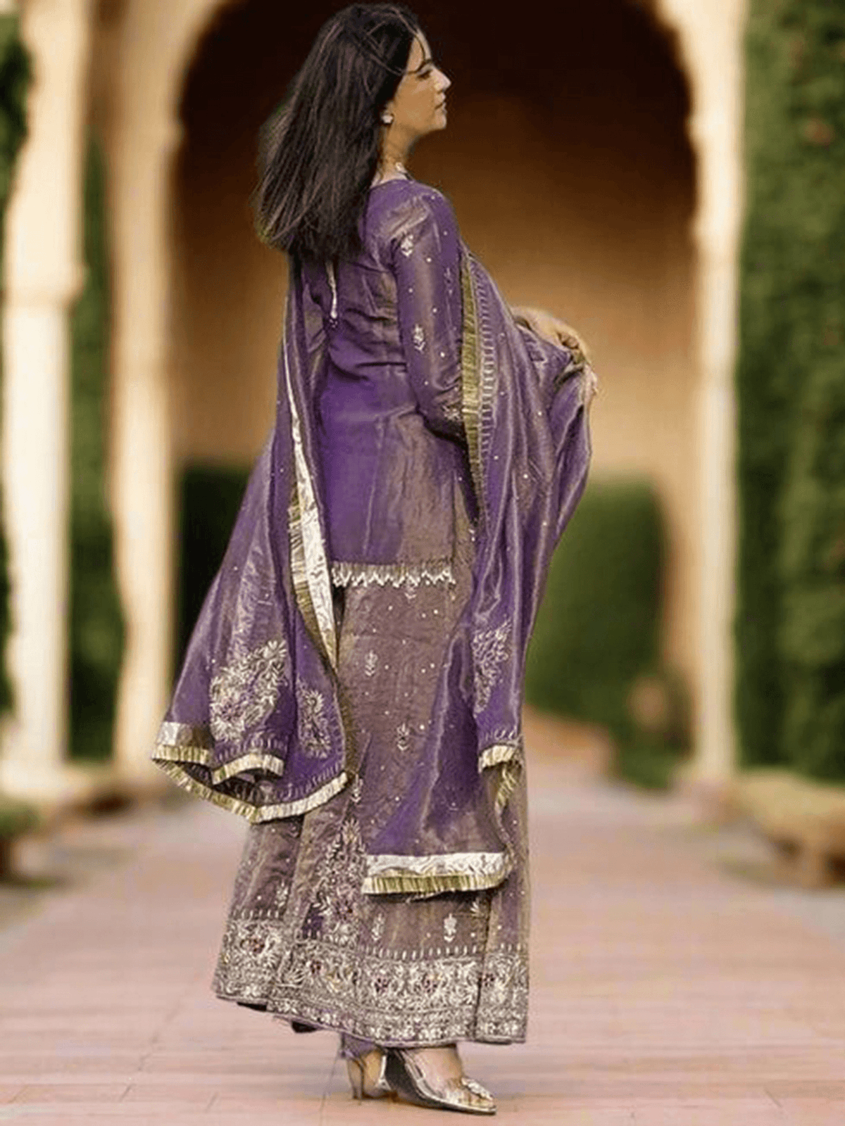 Elegant maroon embroidered kurta set with intricate detailing and flowing dupatta for festive occasions